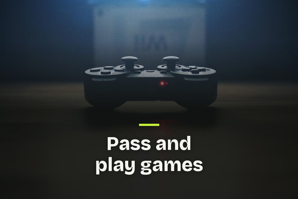 The words "Pass and play games" over a photo of a game controller glowing red on a dark table.