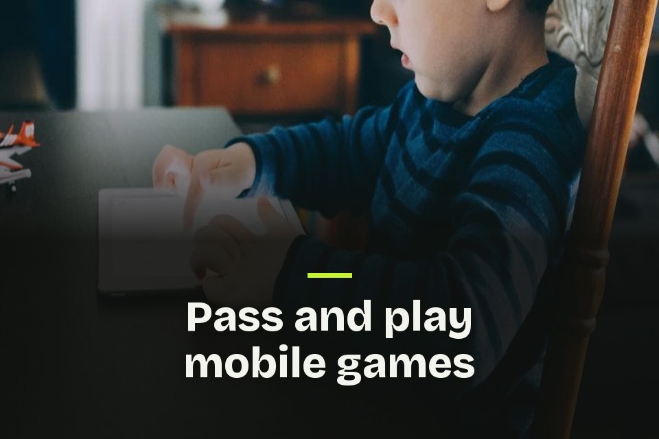 The words "Pass and play mobile games" over a photo of a child in a striped sweater tapping a tablet.