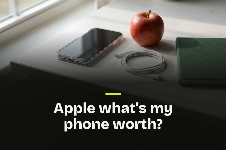 Apple what's my phone worth The words "Apple what's my phone worth?" over a phone in a clear case on a white desk beside a red apple and a cable.