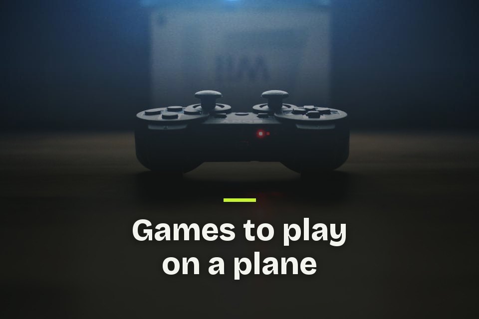 Games to play on a plane The words "Games to play on a plane" over a photo of a game controller glowing red on a dark table.
