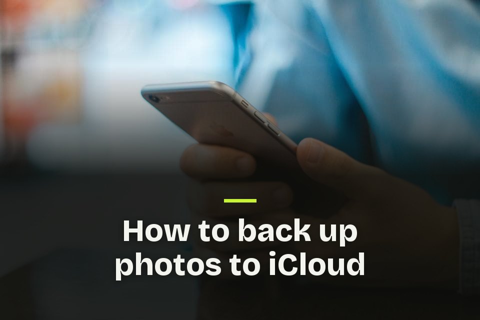 How to back up photos to iCloud The words "How to back up photos to iCloud" over a photo of a hand holding a smartphone.