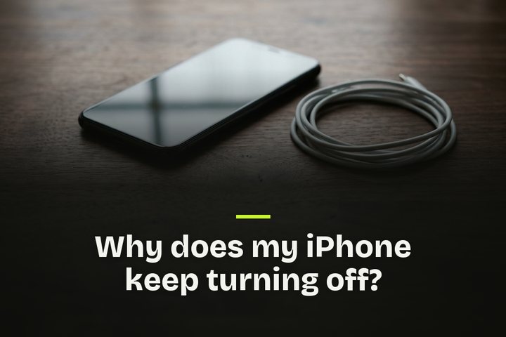 The words "Why does my iPhone keep turning off?" over a picture of a dark phone on a desk beside its charging cable.
